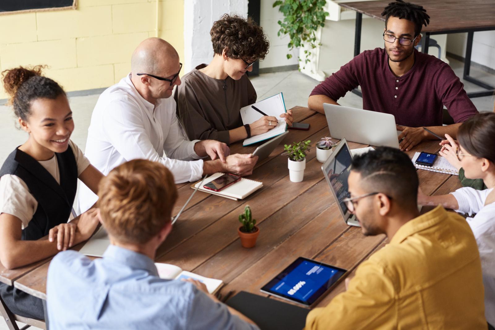 A diverse team collaborating around a conference table